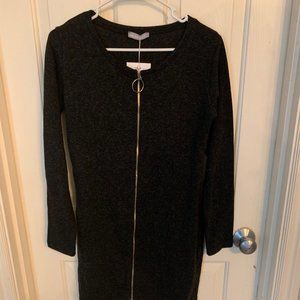 Milan Kiss black long sleeved front zip dress. NWT